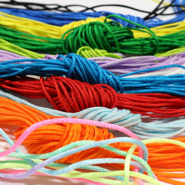 Racing helmet necklace on colored cord